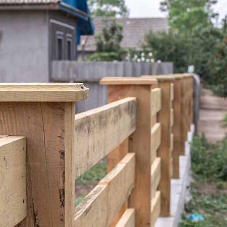Slat style wooden fence