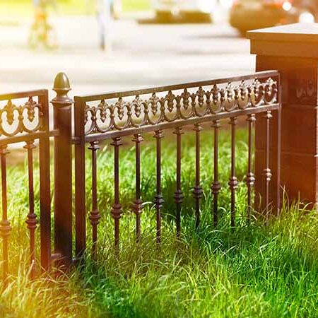 Wrought iron fence with block columns