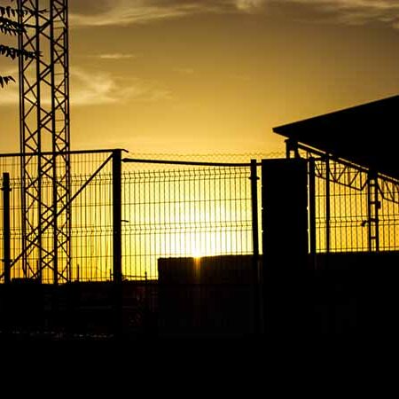 Secure center with silhouette of fence